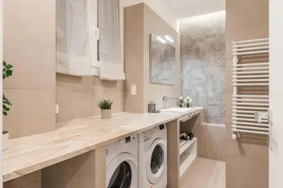 a bathroom with a washing machine and a sink at The Best in Rome Orologio in Rome