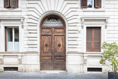 a wooden door on the side of a building at The Best in Rome Orologio in Rome