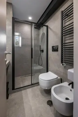a bathroom with a shower and a toilet and a sink at Attico le Stelle de Roma in Rome