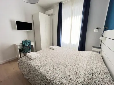 a white washing machine in a room with a window at Casa Latina in Rome
