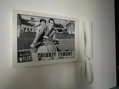 a person walking in a field with a dirt road at Casa Latina in Rome
