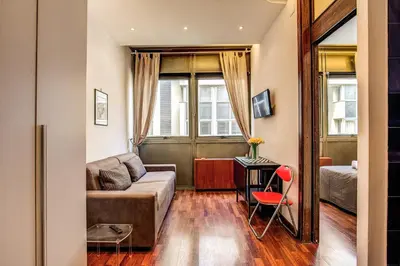 a living room with a couch and a table at M&L Apartments - Ardesia Colosseo in Rome