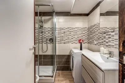 a bathroom with a shower and a sink at M&L Apartments - Ardesia Colosseo in Rome