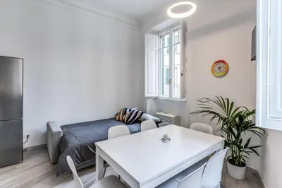 a living room with a couch and a table at Supernova Apartment Trastevere in Rome