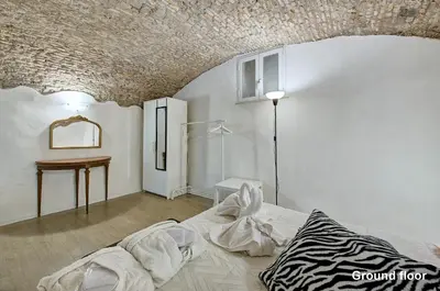 a room with a bed and a table in it at Casa a Monti in Rome