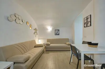 a living room with a couch and a table at Casa a Monti in Rome