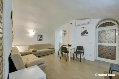 a living room with a couch and a table at Casa a Monti in Rome