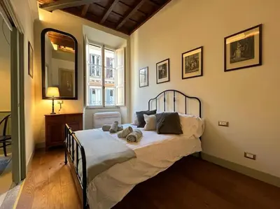 a bedroom with a large bed in a room at Boutique Signature Suite in the Heart of Ancient Rome in Rome