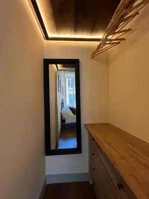 a mirror on a wall in a room at Boutique Signature Suite in the Heart of Ancient Rome in Rome