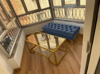 an overhead view of a blue couch and a glass table at PARIOLI LUXURY SUITE III in Rome