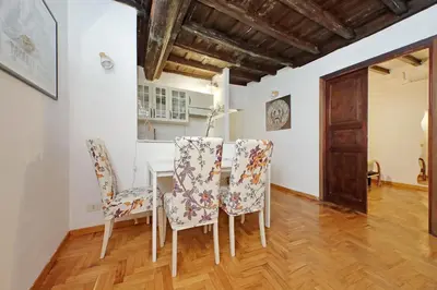 a dining room with a table and chairs at La Civetta a Navona in Rome