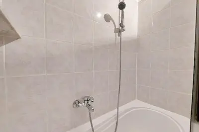 a shower with a shower head in a bathroom at La Civetta a Navona in Rome