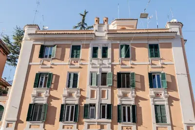 a tall building with a lot of windows at Domina Apartments Roma - San Pietro 1 in Rome