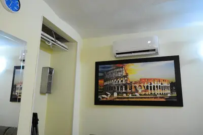 a picture of a building on a wall at Holiday City Center in Rome