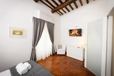 a living room with a couch and a window at Mommy's - Vatican House in Rome