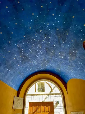 a painting of the stars on the ceiling of a building at Mommy's - Vatican House in Rome