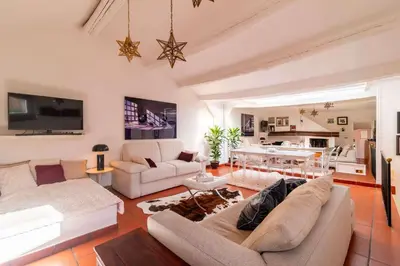 a living room with two couches and a table at Campo de' Fiori Enchanting Attic in Rome