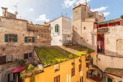 an overhead view of buildings with vegetation on the roofs at Campo de' Fiori Enchanting Attic in Rome