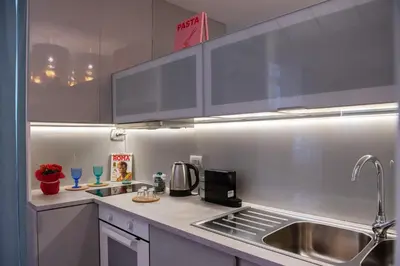 a kitchen with a sink and a counter top at COLOSSEUM VIEW ACCOMODATION in Rome