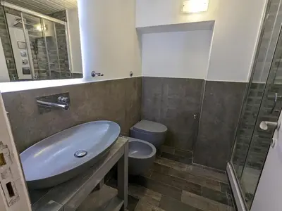 a bathroom with a sink and a toilet and a shower at Borgo Place in Rome