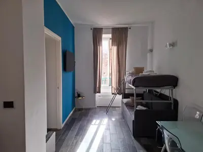 a room with a room with a bed and a window at Borgo Place in Rome