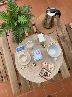 a table with a tea kettle on top of it at ALMA - Vatican Apartment in Rome