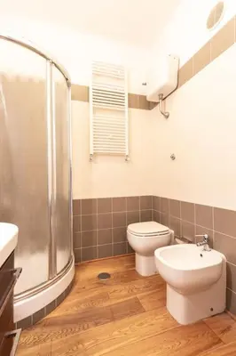 a bathroom with a shower and a toilet and a sink at Gioia Romana in Rome