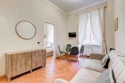 a living room with a couch and a table at URBANA 18 in Rome