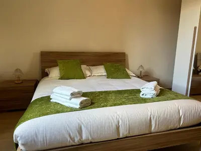a bedroom with a bed with towels on it at Casa Riboty by GHOR in Rome