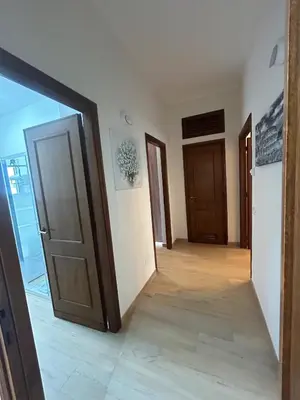 a room with an open door and a hallway at Casa Riboty by GHOR in Rome