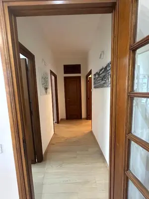 a hallway leading into a room with a door at Casa Riboty by GHOR in Rome