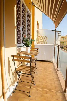 a balcony with a bench and a table at A Casa di Lù a Roma Casa Vacanze in Rome
