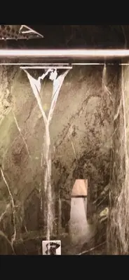 a view of a cave with water coming out of it at Domus Maxima - Rome Suite & Rooms in Rome