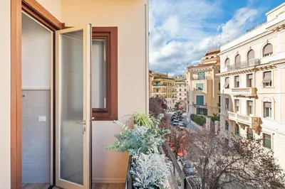 an open door to a balcony with a view of a city at Adelante Apartment in Rome