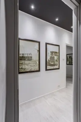 a gallery with three framed pictures on a wall at Gilda Apartment New elegant apartment in Termini in Rome