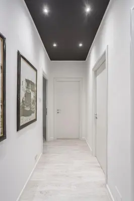 an empty hallway with white walls and a door at Gilda Apartment New elegant apartment in Termini in Rome