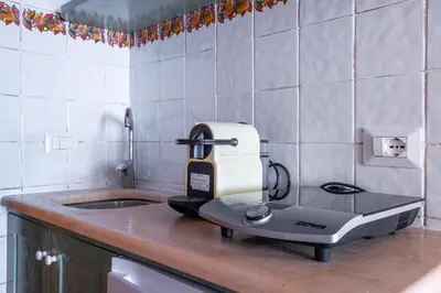 a mixer sitting on a counter in a kitchen at Suite Trevi - Charming Loft Near Trevi Fountain in Rome