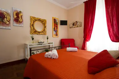 a bedroom with a bed with two towels on it at Holiday Home House Fornaci in Rome