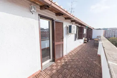a balcony of a building with a window at San Peter's - Cosy Renovated Penthouse in Rome