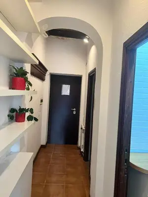 a hallway with a black door in a room at Imperial House San Calisto 7 in Rome