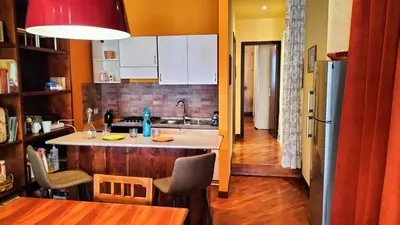 a kitchen with a island in the middle of a room at Benedetta Suite Trastevere in Rome