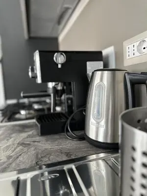a toaster sitting on top of a kitchen counter at Casa Sofia, a 4 fermate metro dal Vaticano in Rome