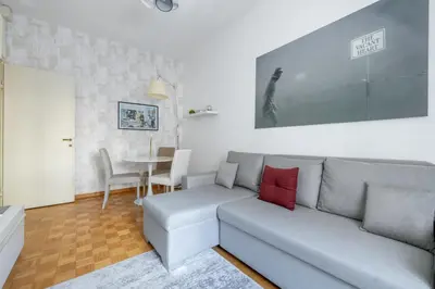 a living room with a couch and a table at Charming suite with view in the heart of Rome in Rome