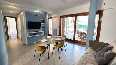 a living room with a table and a couch at D10S SANPIETRO in Rome