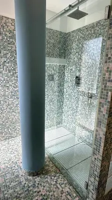 a bathroom with a shower with a glass door at D10S SANPIETRO in Rome