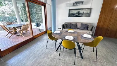 a living room with a table and chairs and a couch at D10S SANPIETRO in Rome