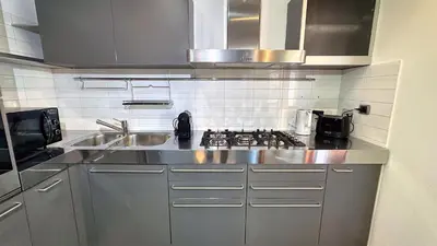 a kitchen with a sink and a stove at D10S SANPIETRO in Rome