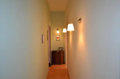 a hallway with two lights on a wall at Holiday home Zia Gina in Rome