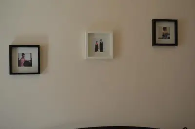 four framed pictures on a white wall at Holiday home Zia Gina in Rome