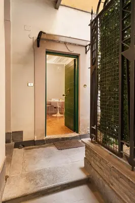 an open door to a room with a table at Fiori Suite in Rome